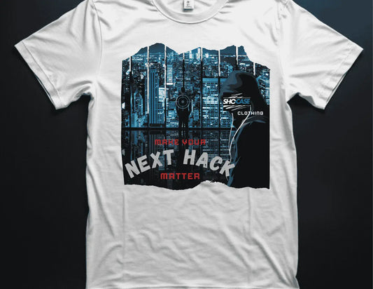 White t-shirt with a graphic design featuring a cityscape and a wealthy shot-caller being stalked by a hacker with an agenda iwth text on a dark background.