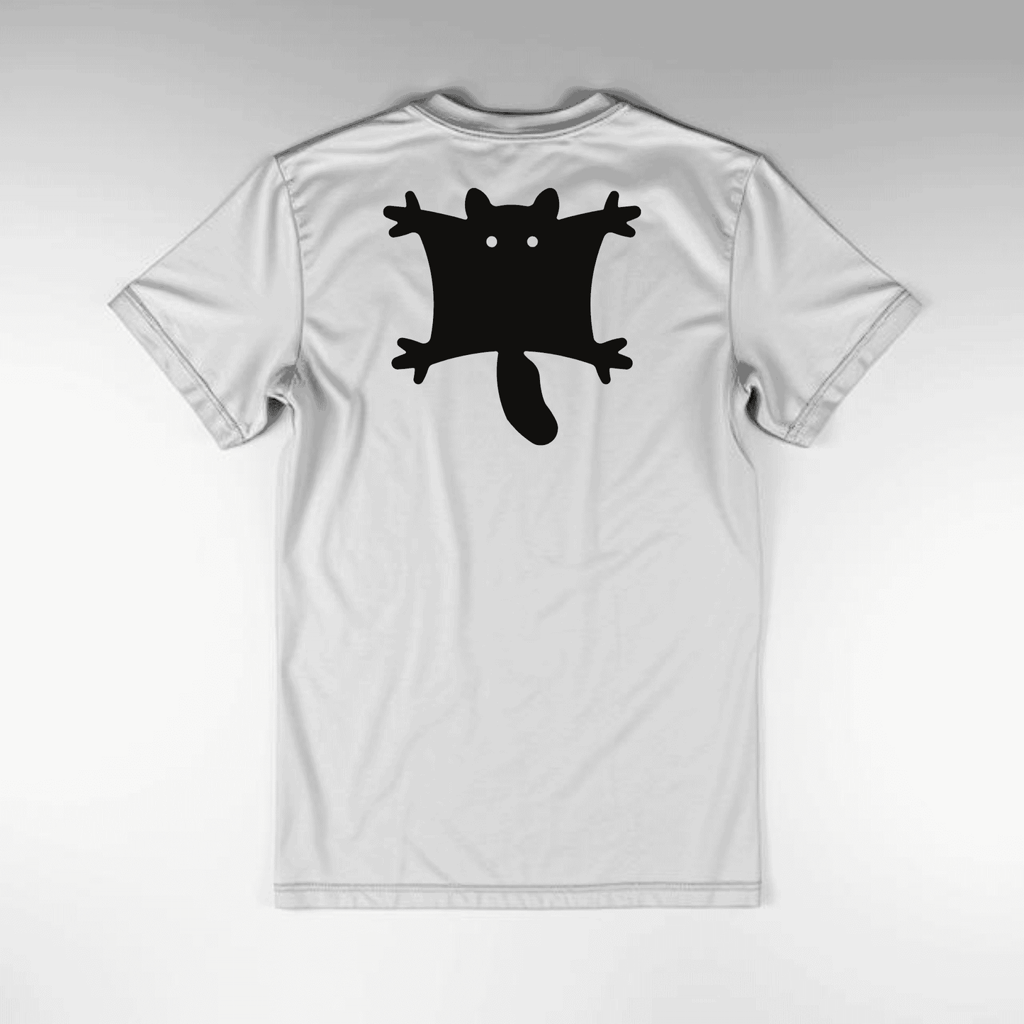 White t-shirt with a black flying sqirrel graphic on a gray shirt